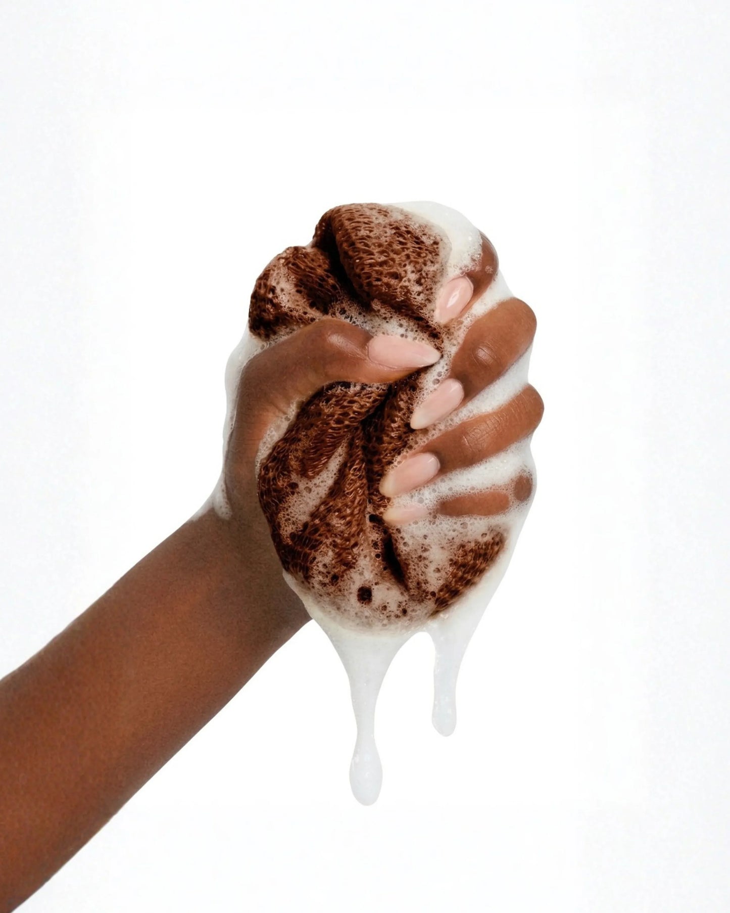 African net sponge from Seele & Bloom, natural exfoliating scrubber with a textured net surface for gentle skin cleansing.