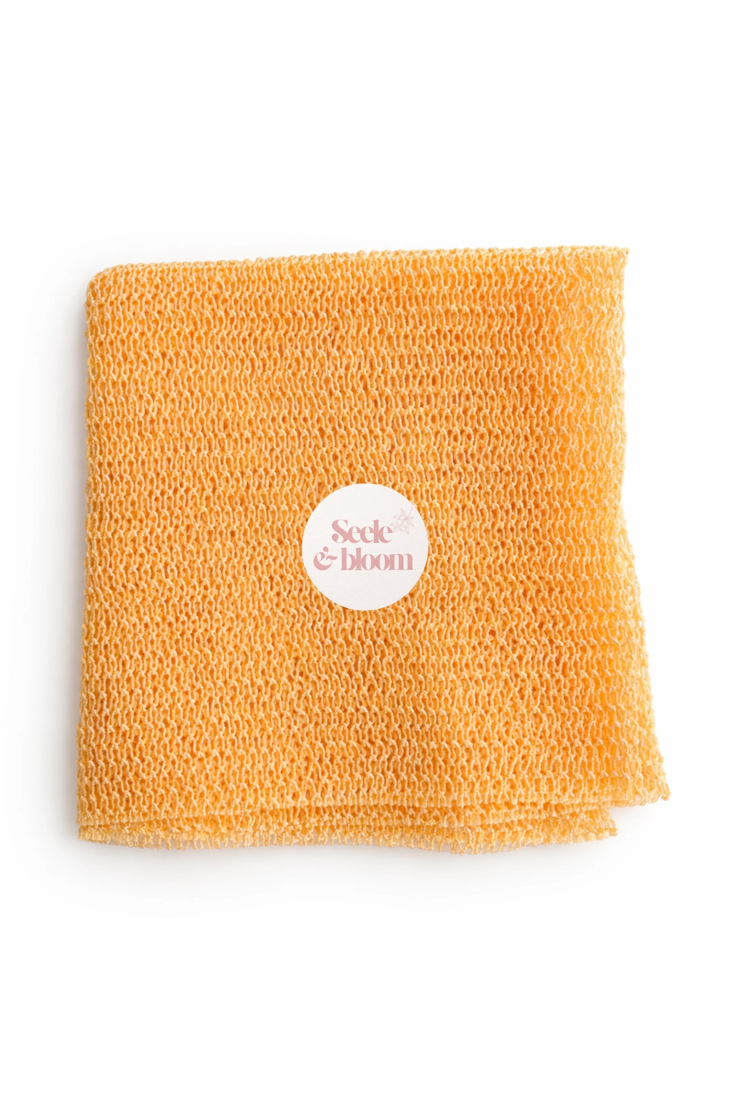 African net sponge by Seele & Bloom, showing a close-up of the textured, natural net material used for exfoliating the skin.
