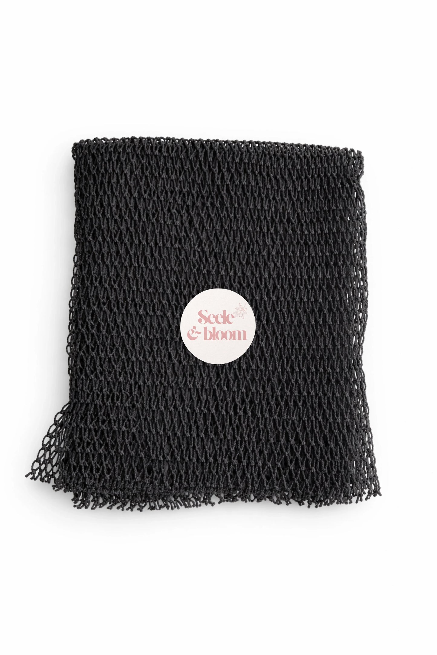 African net sponge from Seele & Bloom, showing a close-up of the textured, lightweight exfoliating sponge used for skincare.