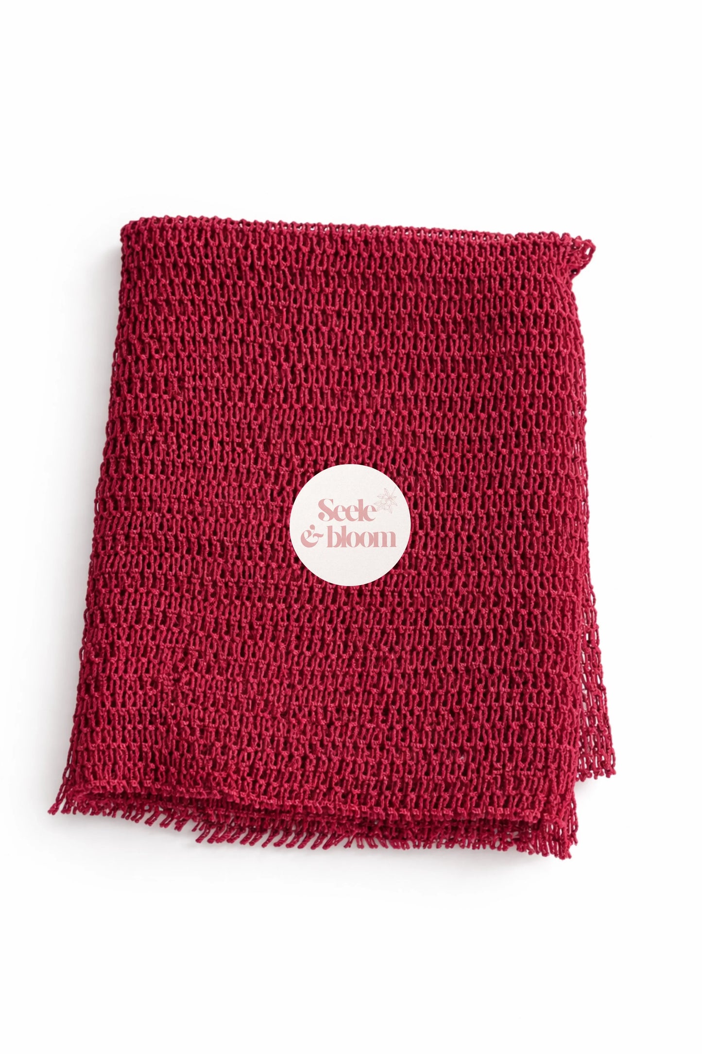 African net sponge by Seele & Bloom, natural exfoliating net sponge for gentle skincare and body cleansing.