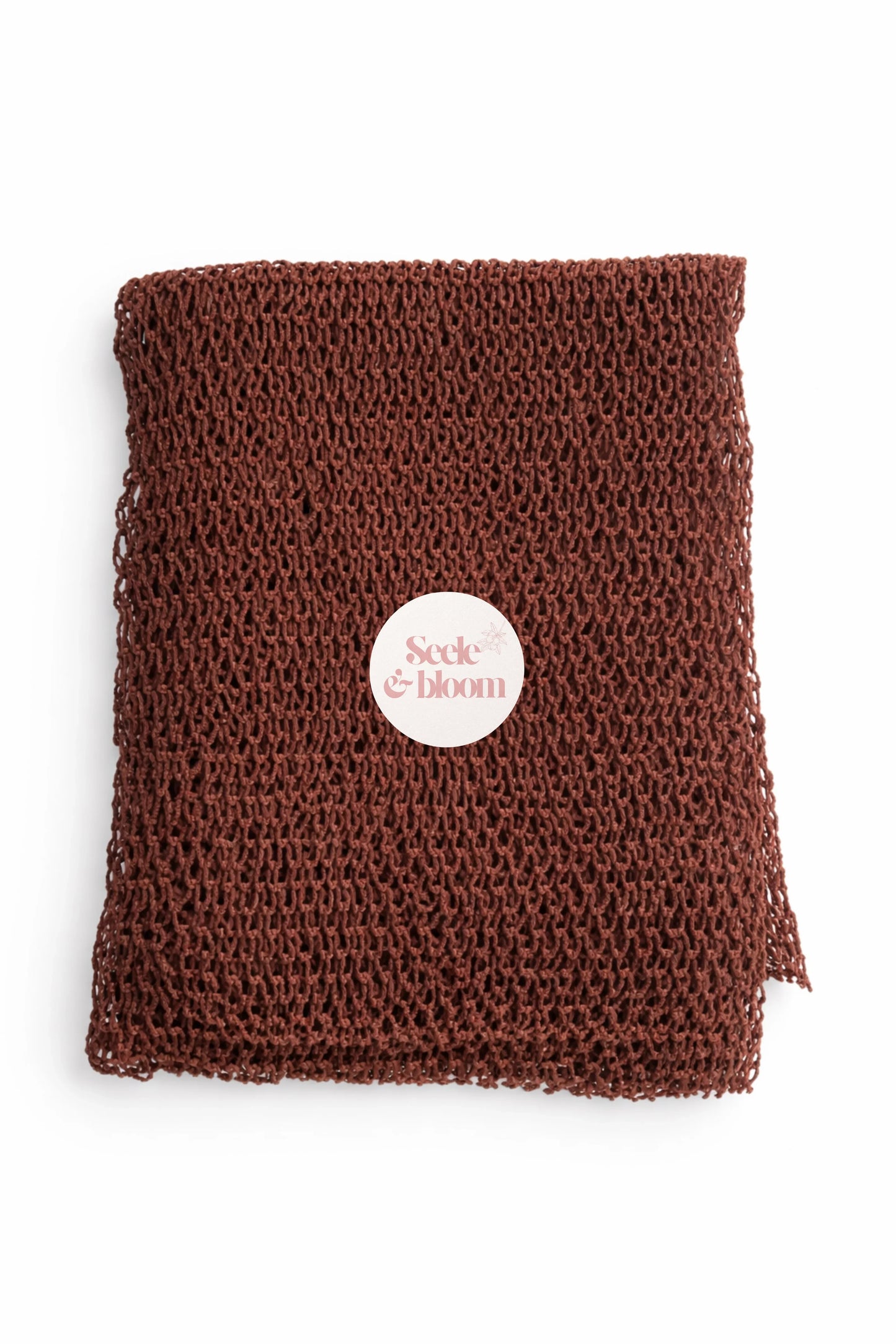 African net sponge by Seele & Bloom, showing a close-up of the natural textured net material used for exfoliation and skincare.