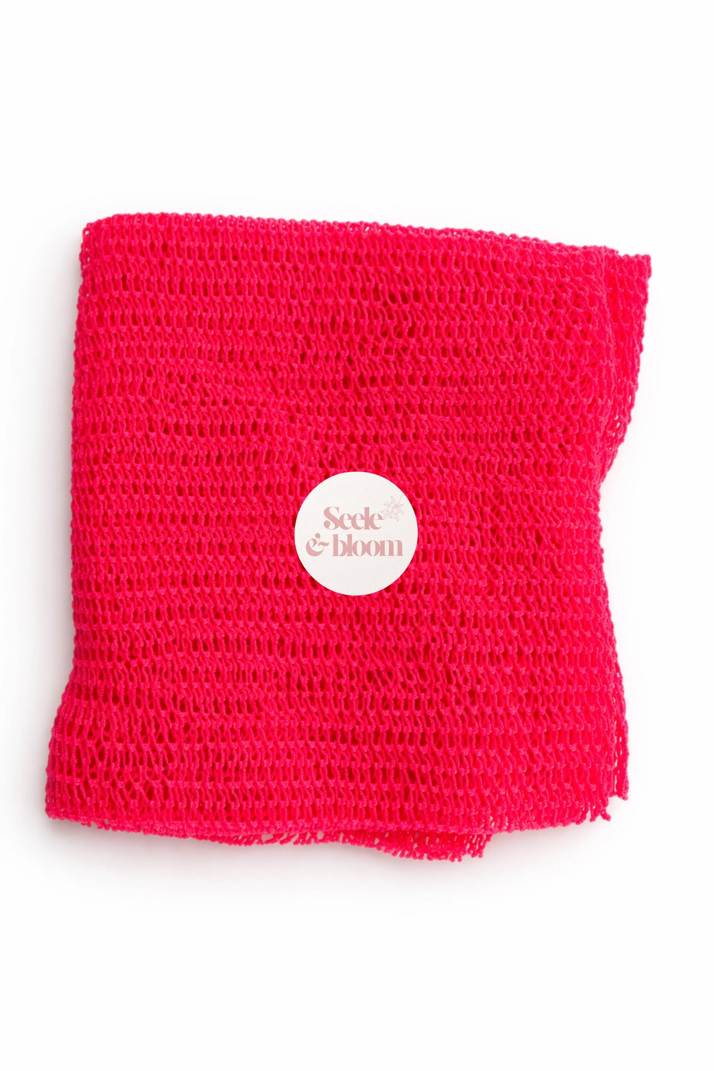 African net sponge by Seele & Bloom, showing a close-up of the textured, natural net material used for exfoliating skin.
