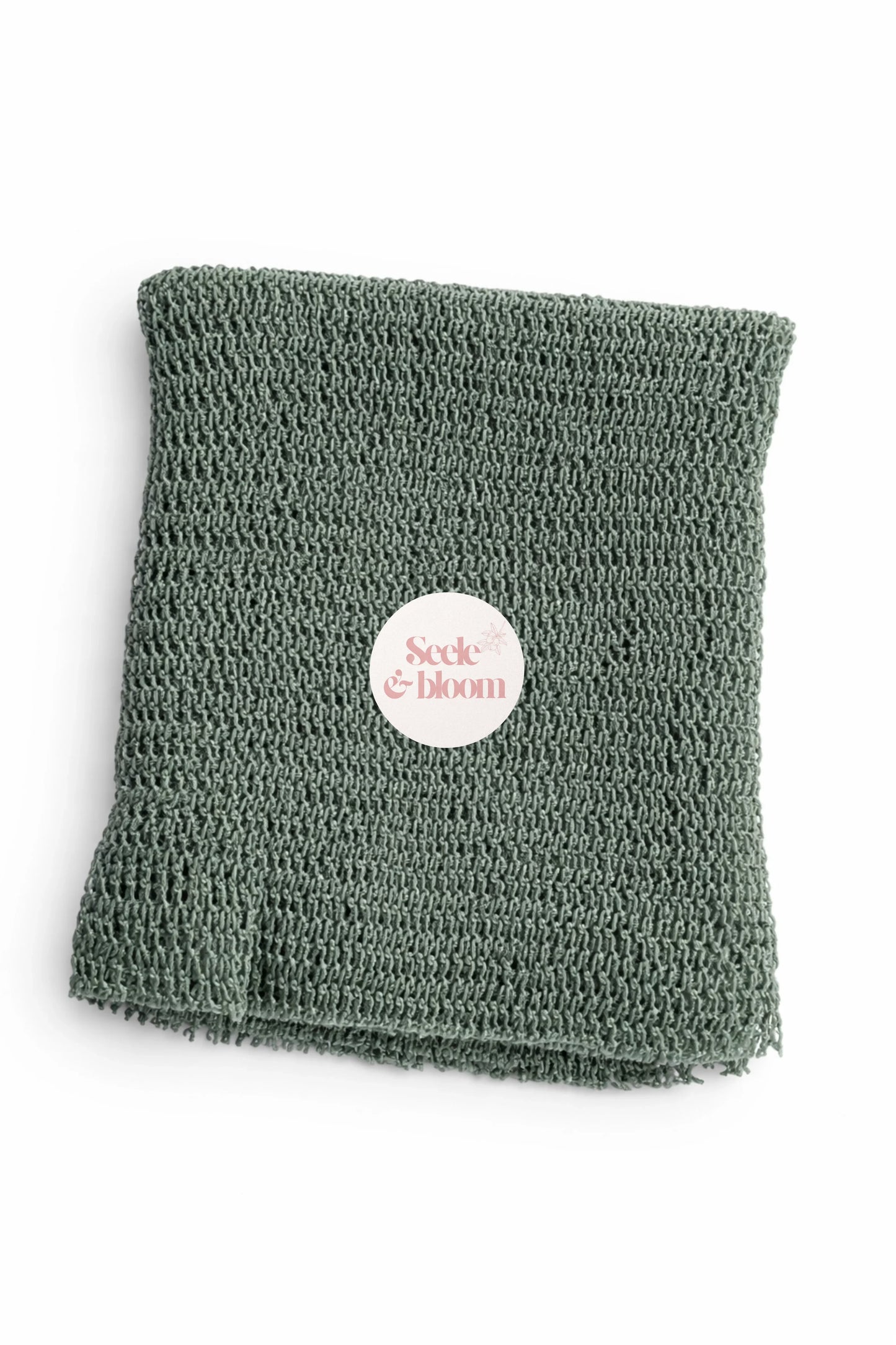 African net sponge by Seele & Bloom, showing a colorful, textured exfoliating net used for skincare and bathing.
