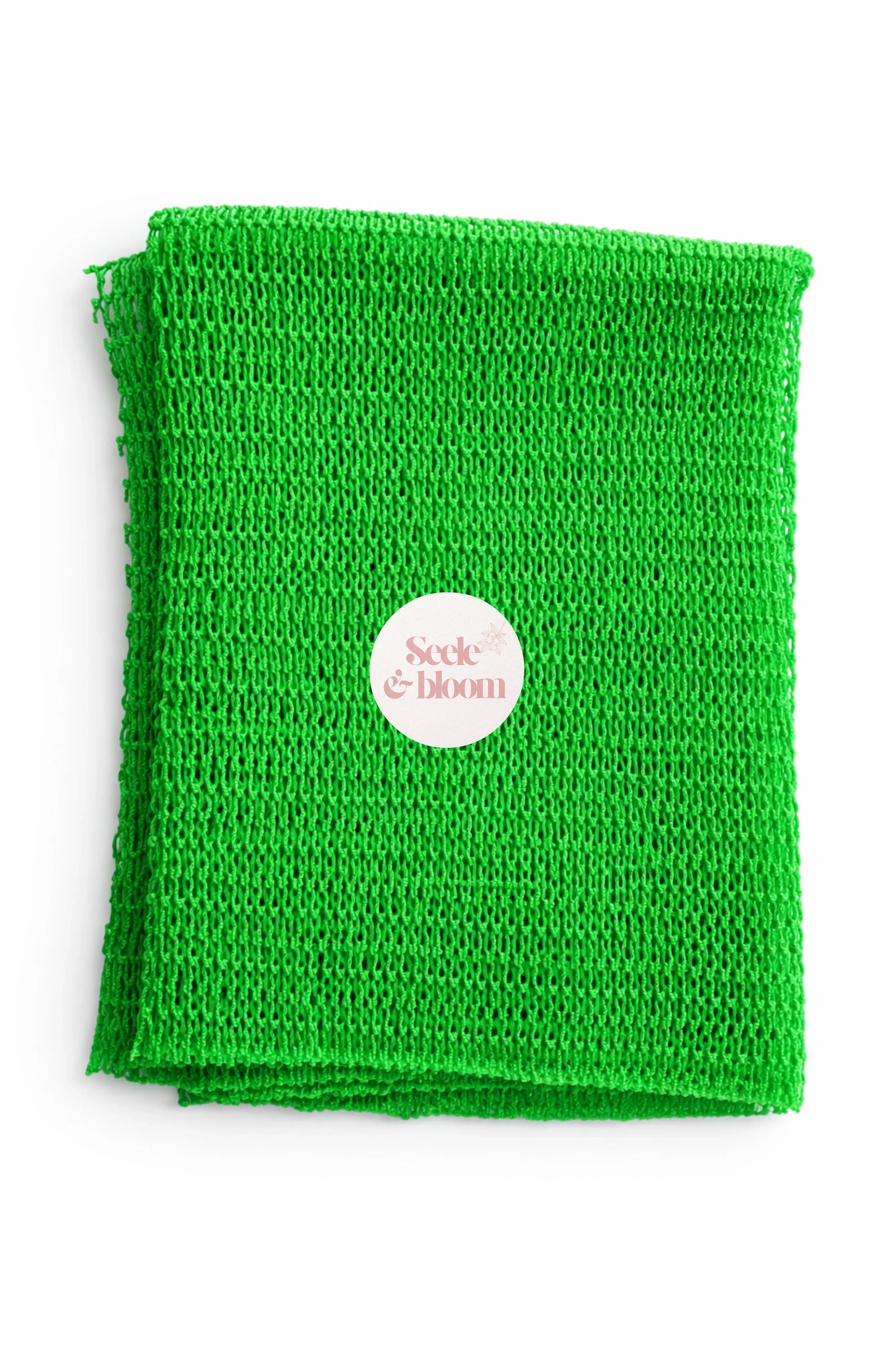 African net sponge by Seele & Bloom with a textured, netted design for gentle exfoliation and cleansing of the skin.