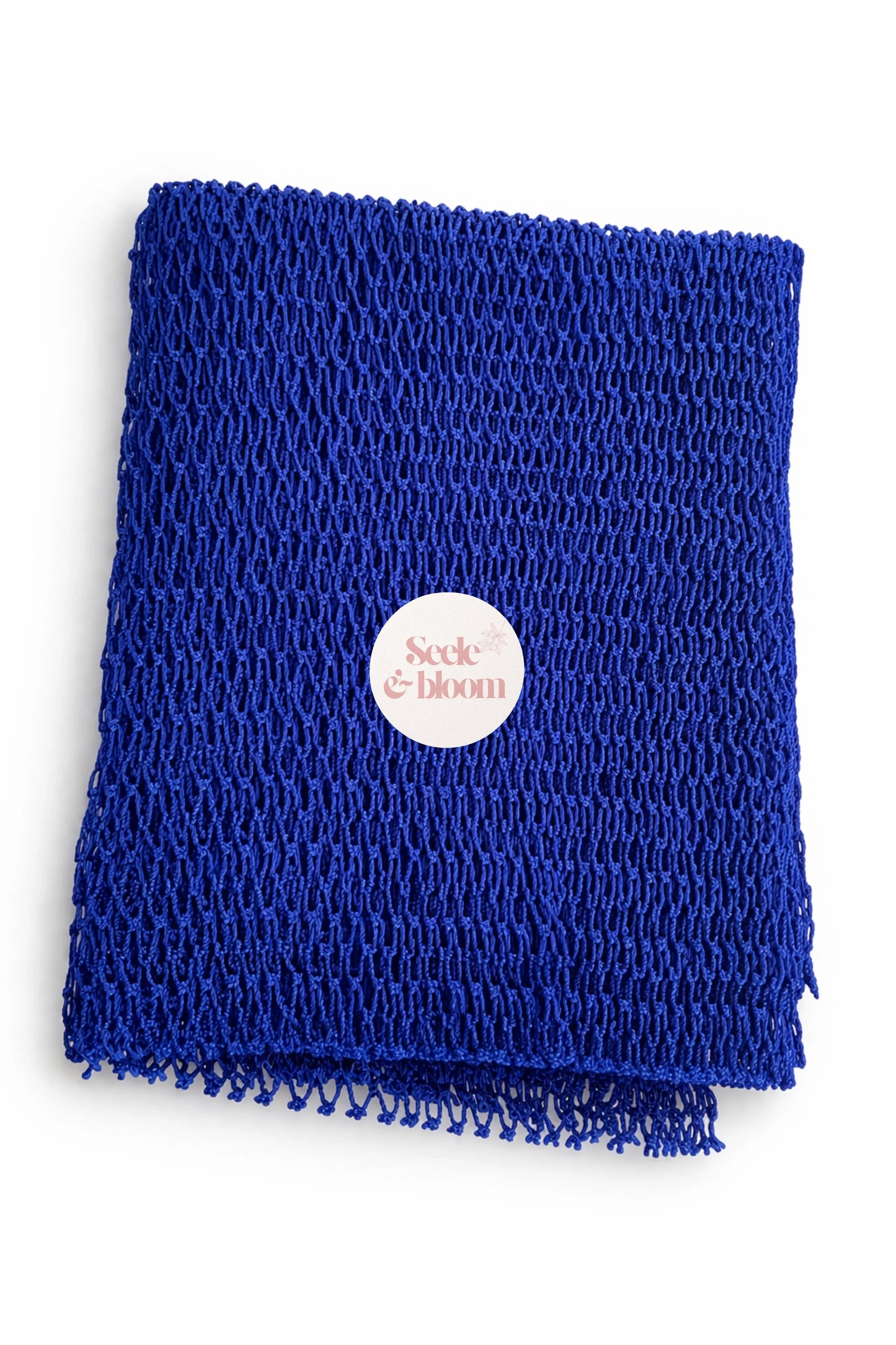 African net sponge from Seele & Bloom, showing a close-up of the textured, woven net material used for gentle skin cleansing.