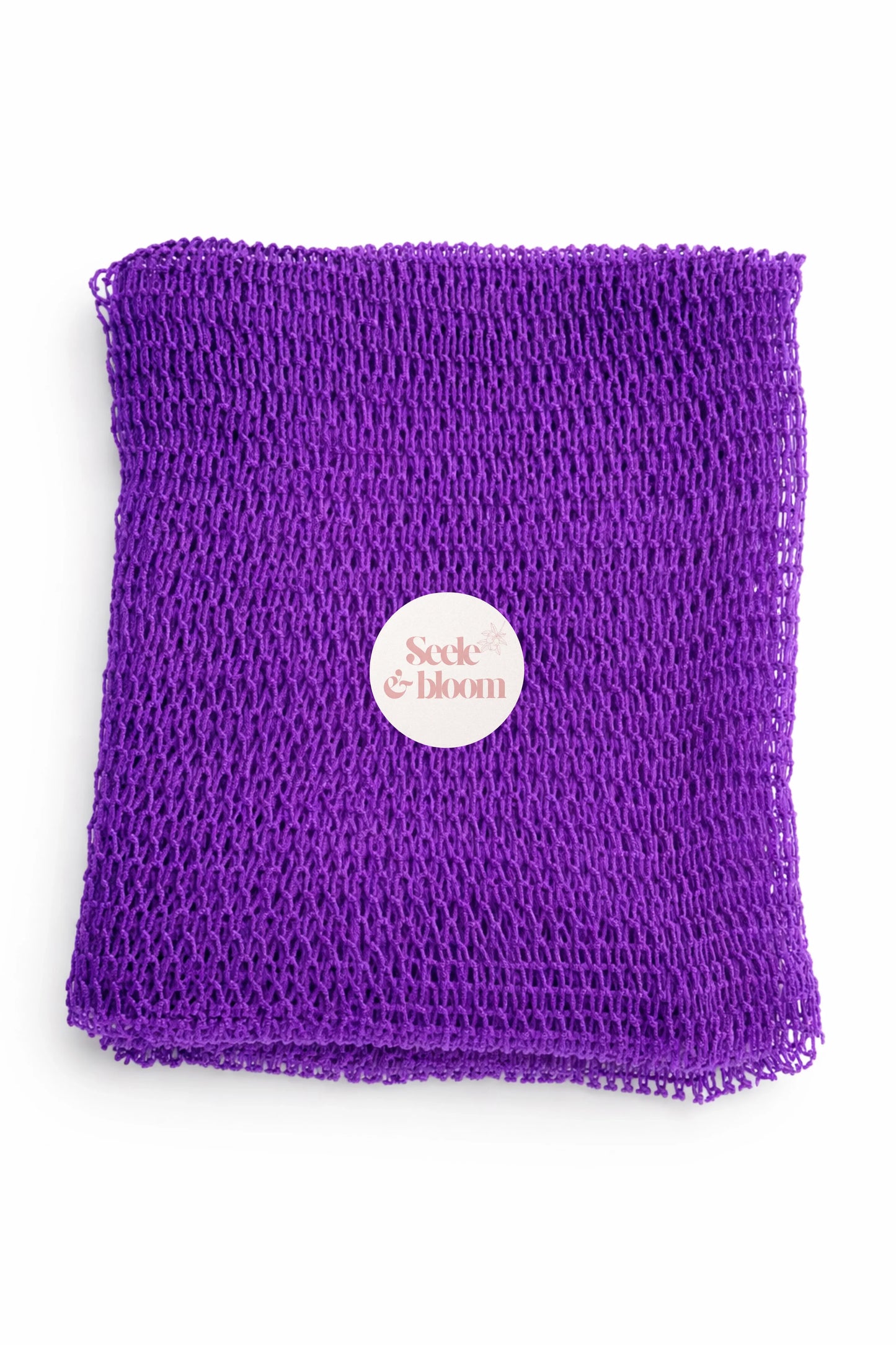 Seele & Bloom African net sponge with open mesh design for gentle exfoliation and cleansing of skin.