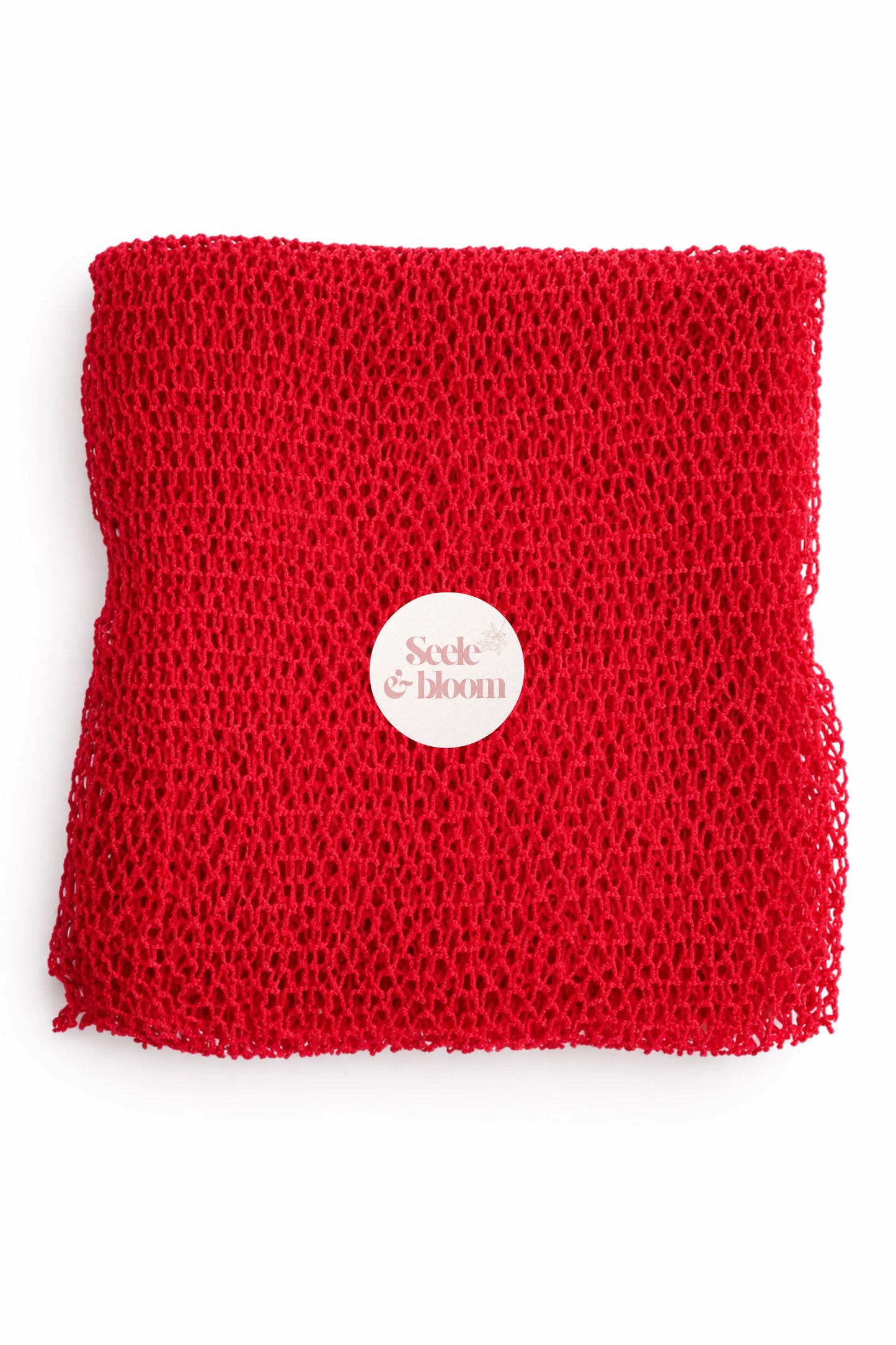Seele & Bloom African net sponge, natural exfoliating scrubber with a mesh texture for gentle skin cleansing.