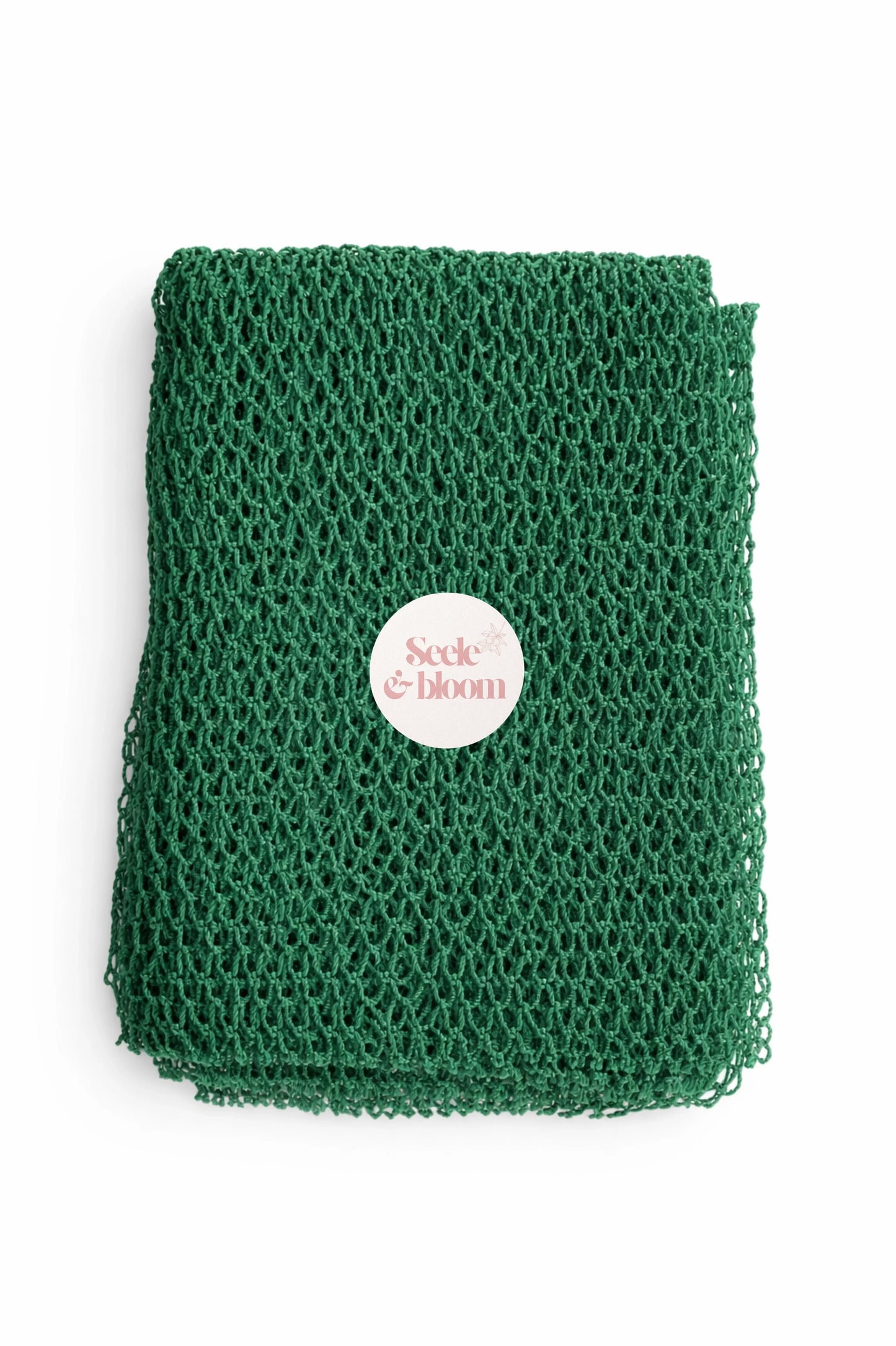 Seele & Bloom African net sponge with natural mesh texture for gentle exfoliation and skincare.