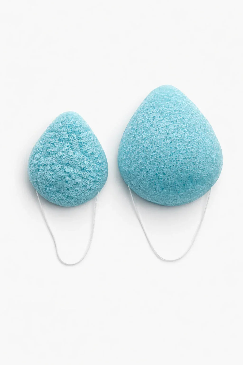 Seele & Bloom konjac sponge for gentle facial cleansing, showing the soft, natural-textured sponge on a white background.